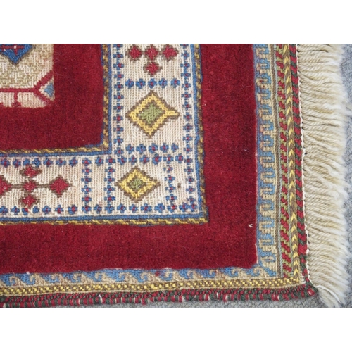 890 - A RED GROUND SOZANI RUG