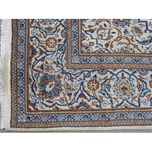 891 - A CREAM GROUND KASHAN RUG