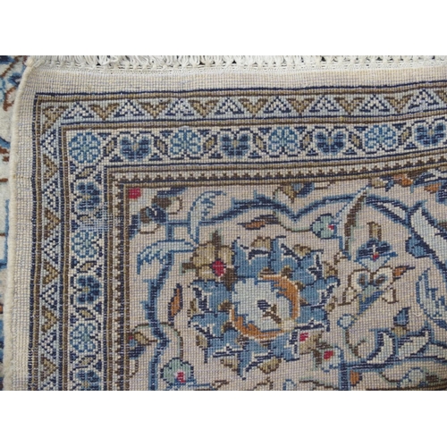 891 - A CREAM GROUND KASHAN RUG