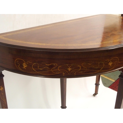 894 - AN EDWARDIAN MAHOGANY INLAID DEMI-LUNE FOLD OVER CARD TABLE