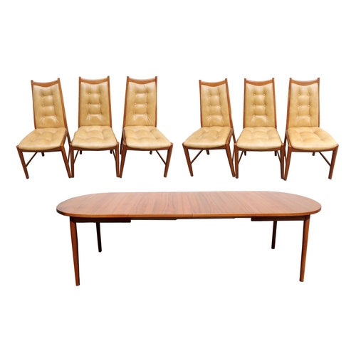 911 - A MID-CENTURY TEAK EXTENDING DINING TABLE