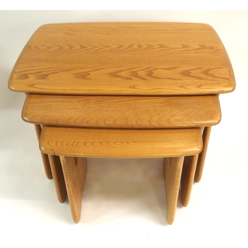 918 - A LIGHT ERCOL WINDSOR NEST OF THREE TABLES