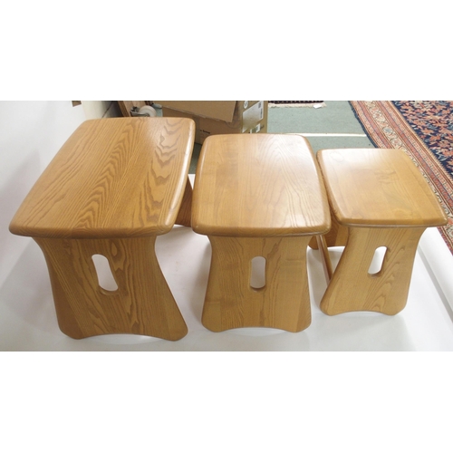 918 - A LIGHT ERCOL WINDSOR NEST OF THREE TABLES