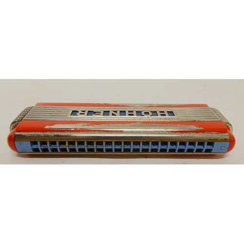An Echo Elite Hohner harmonica and an MGM accordion harp