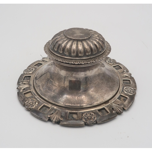 382 - An Edwardian large silver capstan inkwell, the base decorated with cinquefoils and leaves, the lobed... 