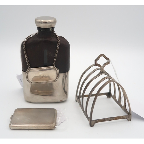 385 - A white metal and glass hip flask, the top half of the body covered with leather, with a silver gin ... 