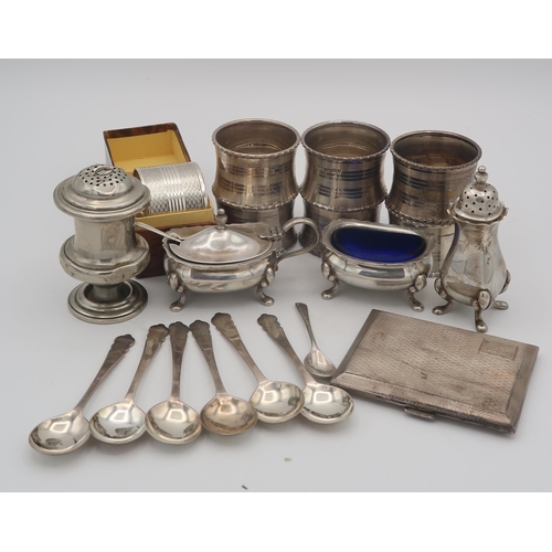 397 - A set of six silver napkin rings, the body with banded decoration surrounding initialled cartouches,... 