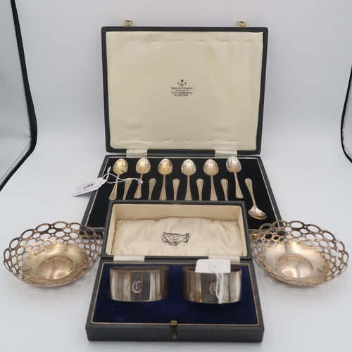 407 - A collection of silver including a pair of silver bon bon dishes, the bodies with pierced oval decor... 