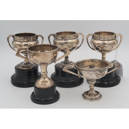 408 - A collection of five silver presentation trophy cups, two from the Lansdowne Church Golf Club, four ... 