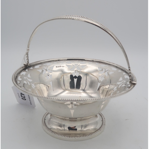 420 - A silver swing handled basket, the body with openwork Art Nouveau decoration, with beaded rims and h... 