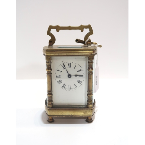 254 - A French brass and glass carriage clock, retailed by Sorley Glasgow, with key