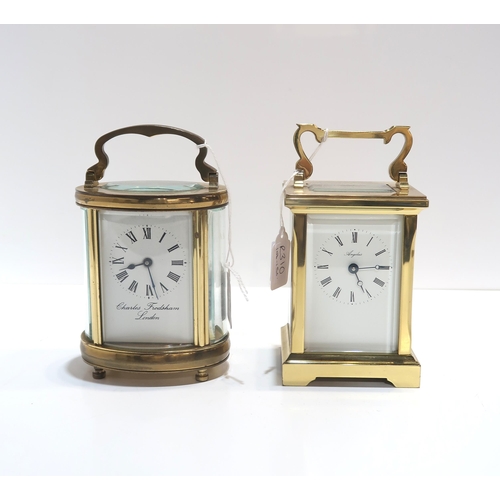 255 - A Charles Frodsham oval carriage clock together with a Angelus carriage clock