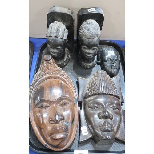 279 - African carved hardwood busts, a pair of bookends, wall masks etc