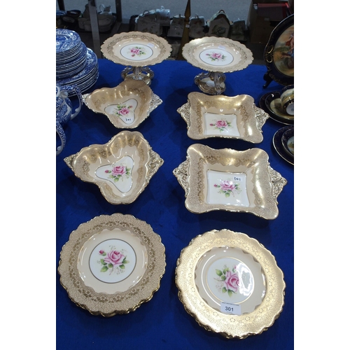 301 - A Paragon dessert service decorated with pink roses within a gilt lace border, pattern no G4613, com... 