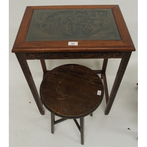 103 - A 20th century Chinese hardwood occasional table with extensively carved top depicting village scene... 