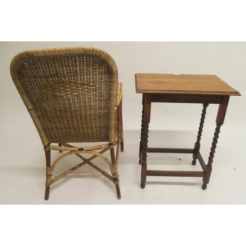 104 - A 20th century Dryad wicker armchair and an oak barley twist occasional table (2)