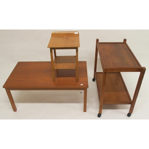 105 - A mid 20th century teak coffee table, teak two tier tea trolley and a laminated top stool (3)