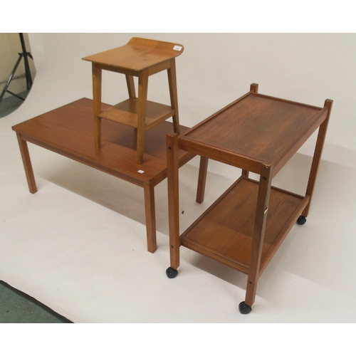 105 - A mid 20th century teak coffee table, teak two tier tea trolley and a laminated top stool (3)