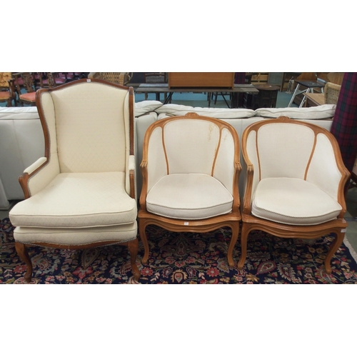 111 - A pair of 20th century tub chairs and a 20th century wingback armchair (3)