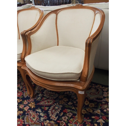 111 - A pair of 20th century tub chairs and a 20th century wingback armchair (3)