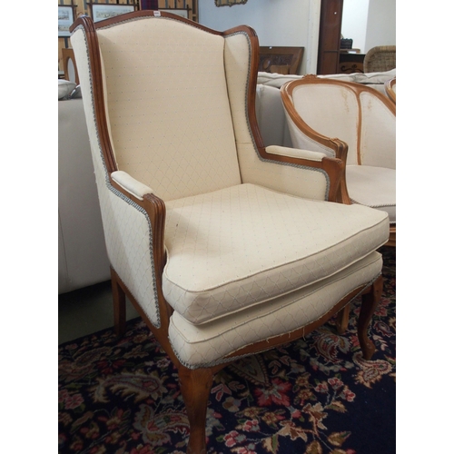 111 - A pair of 20th century tub chairs and a 20th century wingback armchair (3)