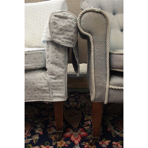 113 - A pair of Victorian armchairs both with square tapering supports terminating in ceramic casters, one... 