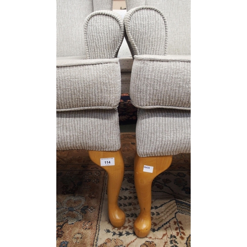 114 - A pair of contemporary wing back armchairs with light grey upholstery on cabriole supports (2)