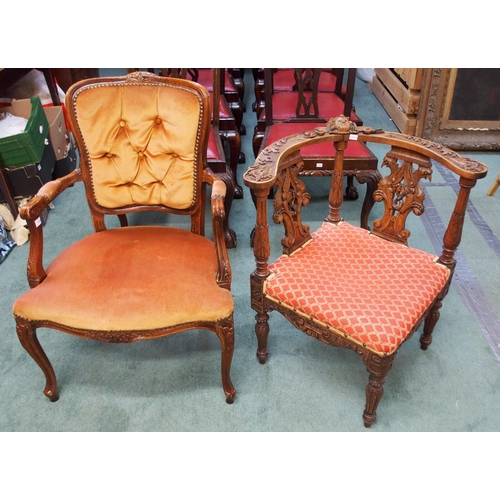 119 - A Victorian oak corner chair carved with carved cherub surmount, dual splats carved with pairs of bi... 