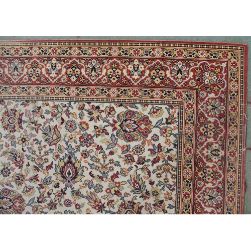 130 - A 20th century cream ground eastern style rug with all over design and dark red borders, 365cm long ... 