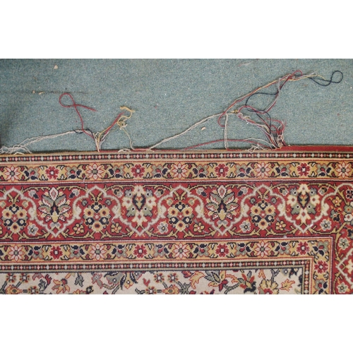 130 - A 20th century cream ground eastern style rug with all over design and dark red borders, 365cm long ... 