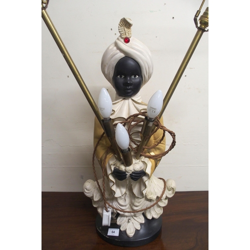 64 - A blackamoor style ceramic table lamp in the form of a boy in turban