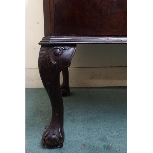 73 - A 20th century mahogany serpentine front sideboard with three central drawers flanked by cabinet doo... 