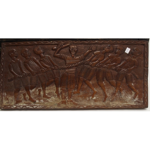 80 - A 20th century decorative wall plaque depicting a tug of war and a wood bound travel trunk (2)