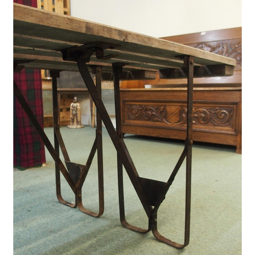 82 - A pair of 20th century wooden benches with iron folding supports, 50cm high x 181cm long x 24cm deep... 