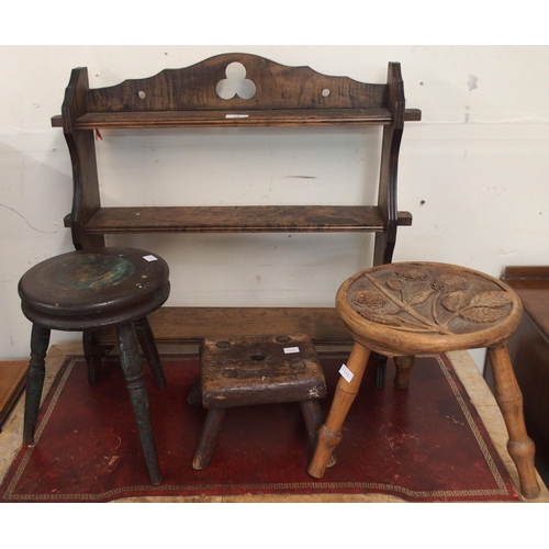 88 - An early 20th century oak arts and crafts style three tier wall shelf, a circular stool carved with ... 