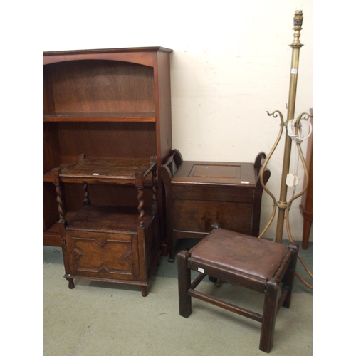 97 - A 20th century hardwood open bookcase, mahogany commode, brass standard lamp, oval wall mirror, oak ... 