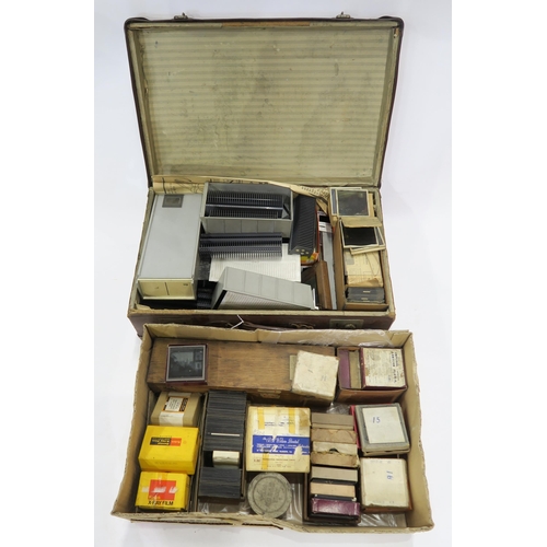 553 - An extensive selection of monochrome and coloured glass photographic slides, including international... 