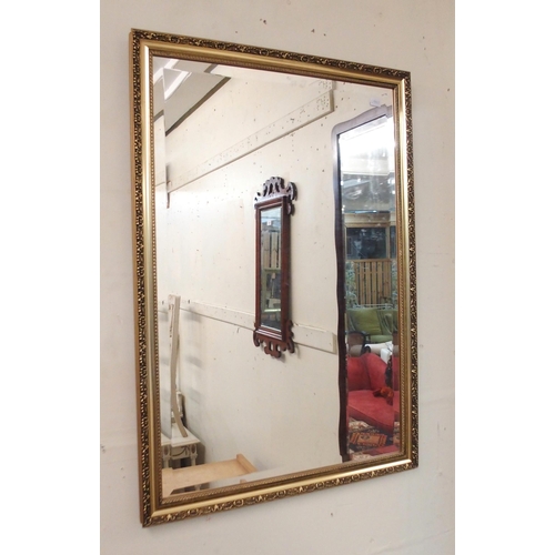 101 - A 20th century gilt framed bevelled glass wall mirror, a mahogany framed bevelled glass wall mirror ... 