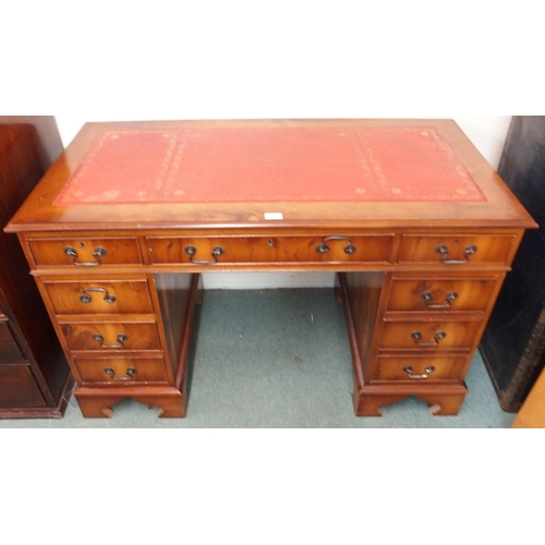 104 - A 20th century mahogany twin pedestal writing desk with red leather skiver