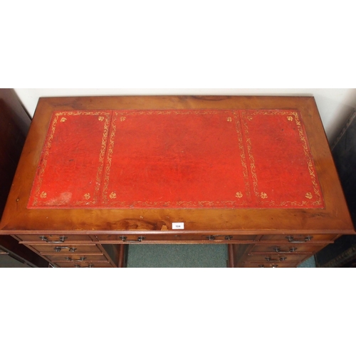 104 - A 20th century mahogany twin pedestal writing desk with red leather skiver