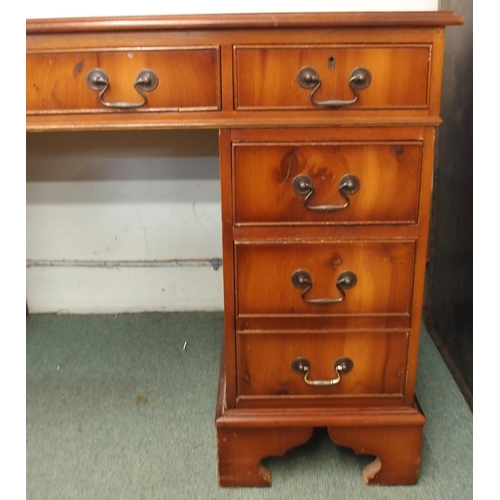 104 - A 20th century mahogany twin pedestal writing desk with red leather skiver