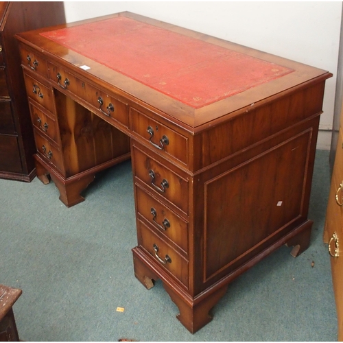 104 - A 20th century mahogany twin pedestal writing desk with red leather skiver