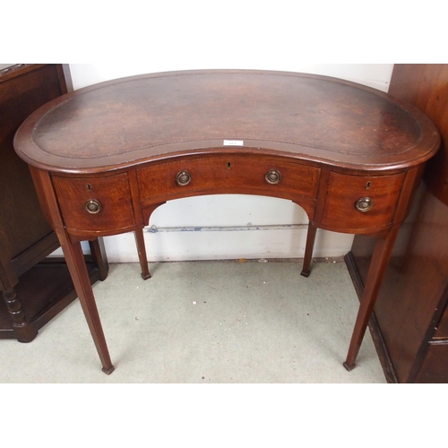 107 - A 20th century mahogany kidney shaped ladies writing desk