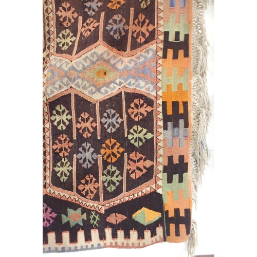 108 - A multicoloured ground Turkish Kilim rug with all over geometric design