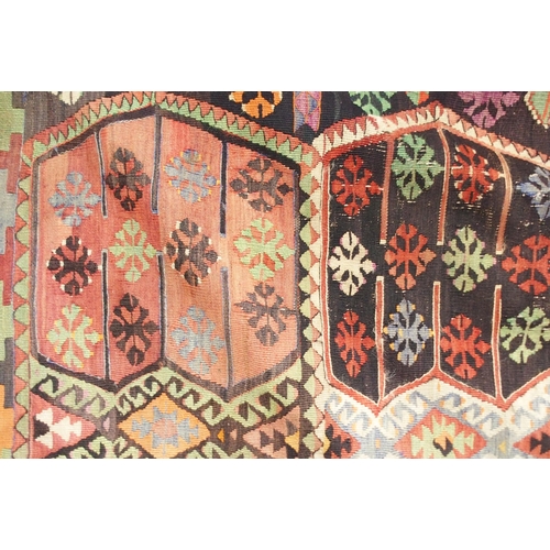 108 - A multicoloured ground Turkish Kilim rug with all over geometric design