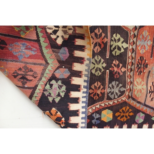 108 - A multicoloured ground Turkish Kilim rug with all over geometric design