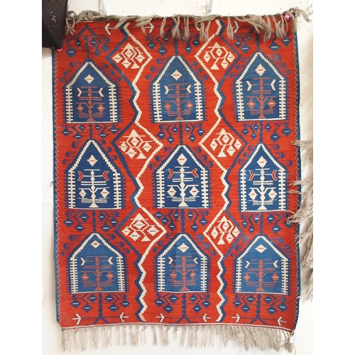 111 - A red ground Turkish tribal rug all over geometric design