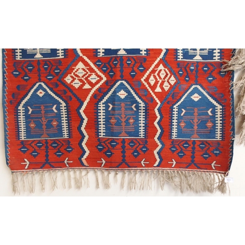 111 - A red ground Turkish tribal rug all over geometric design