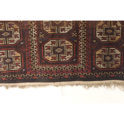 113 - A dark ground Bokhara style prayer rug