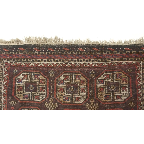 113 - A dark ground Bokhara style prayer rug